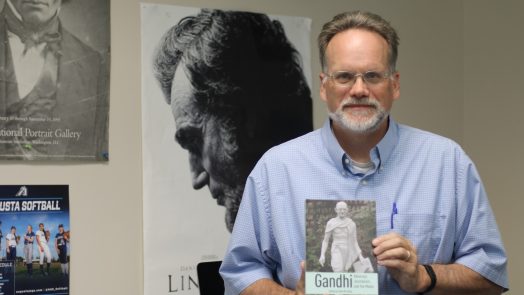 Man standing with book