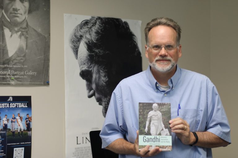 Man standing with book