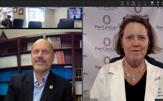 Man in office and woman in white coat on split screen Zoom call