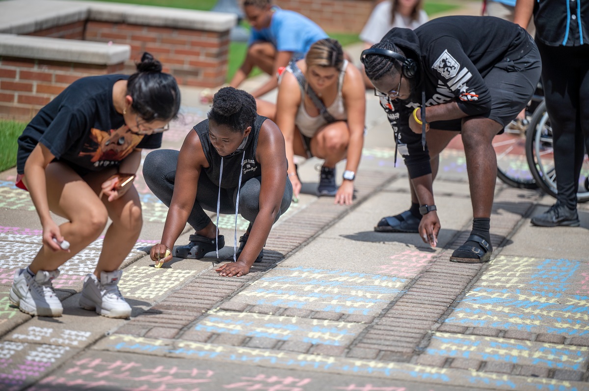 students use chalk out the sidewalk