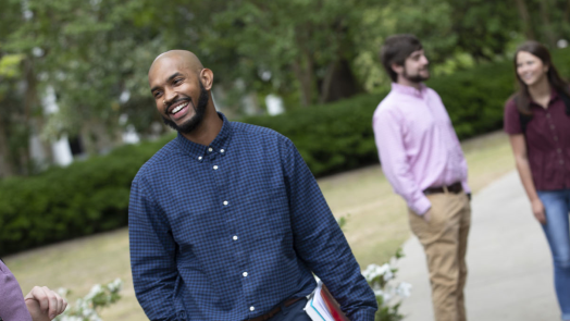 students standing outside talking