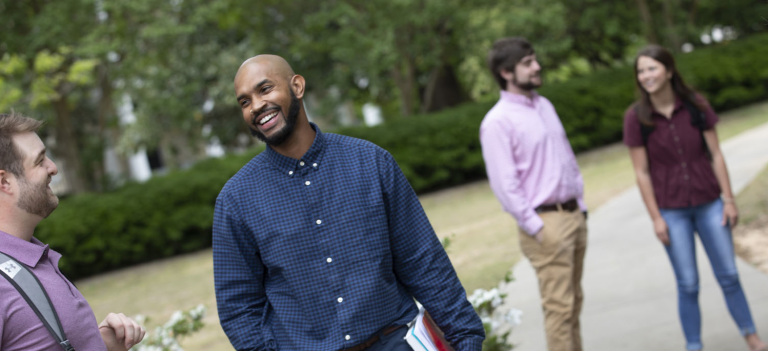 students standing outside talking