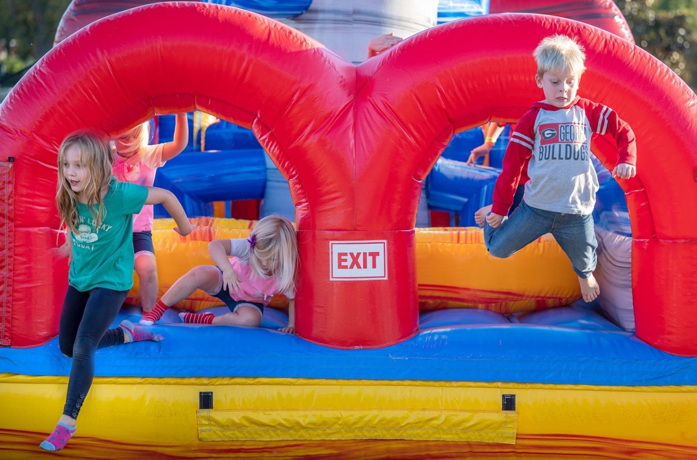 Children jumping in bouncy house