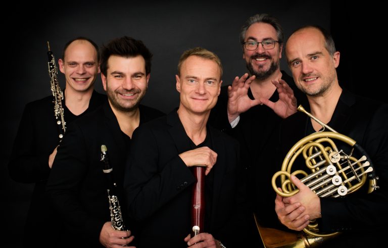 five men with musical insturments