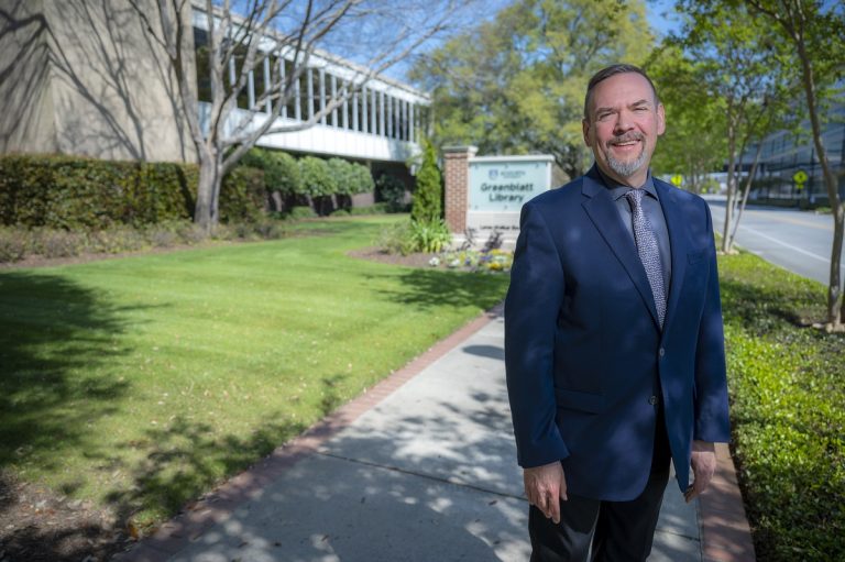 Man standing outside smiling