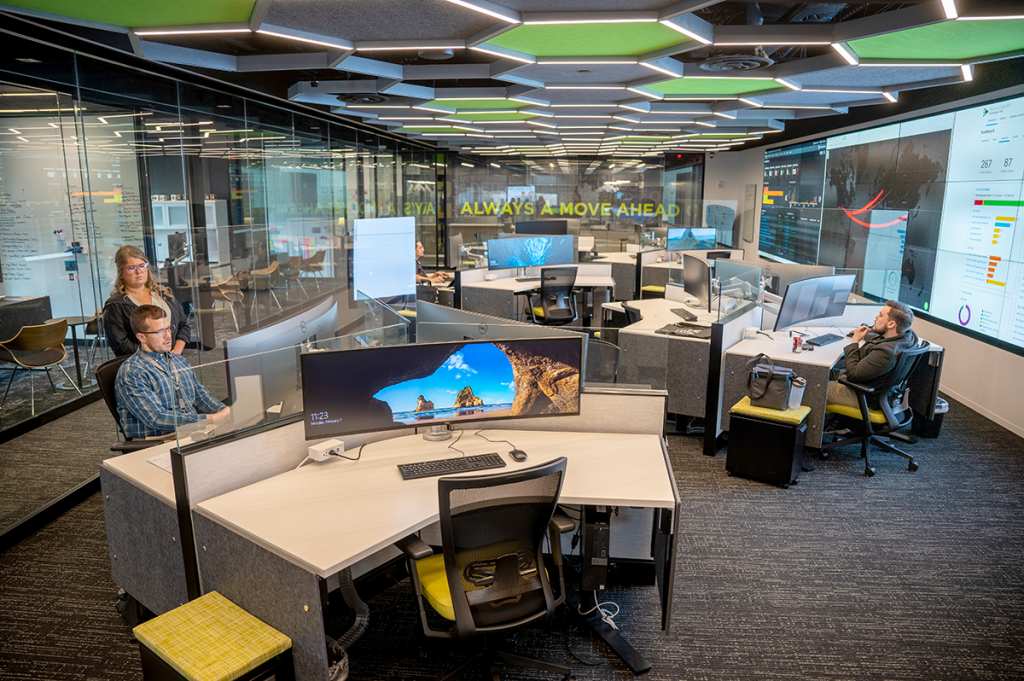 people sit at computers in a computer lab