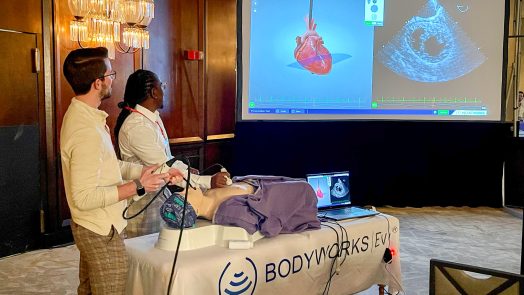 Nursing students showing ultrasound equipment presentation