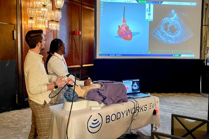 Nursing students showing ultrasound equipment presentation