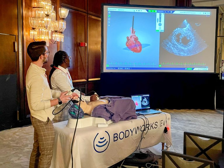 Nursing students showing ultrasound equipment presentation