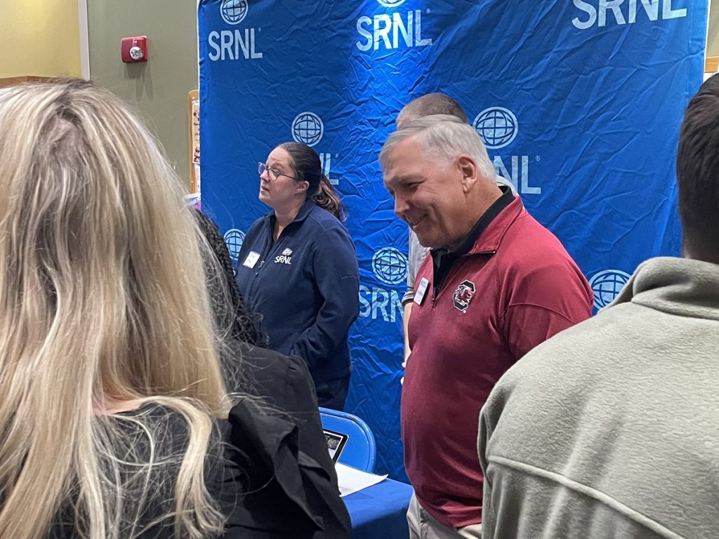 Man speaking to students at job fair