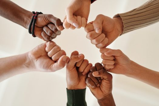 6 hands fist-bumping
