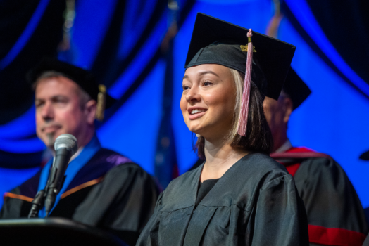 woman speaking at commencement ceremony