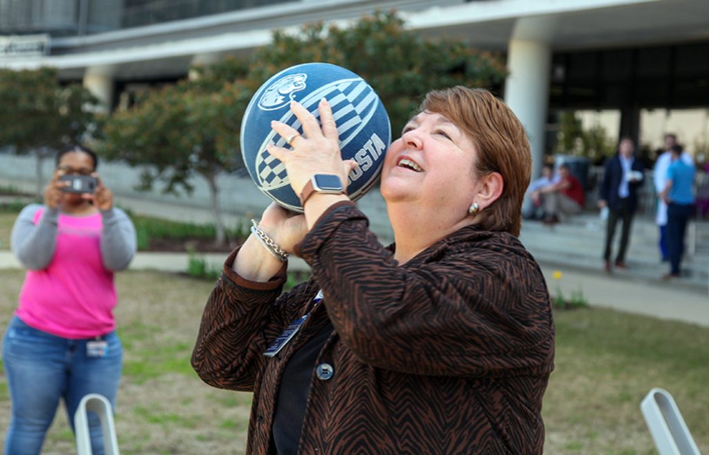 Woman shooting a basketball