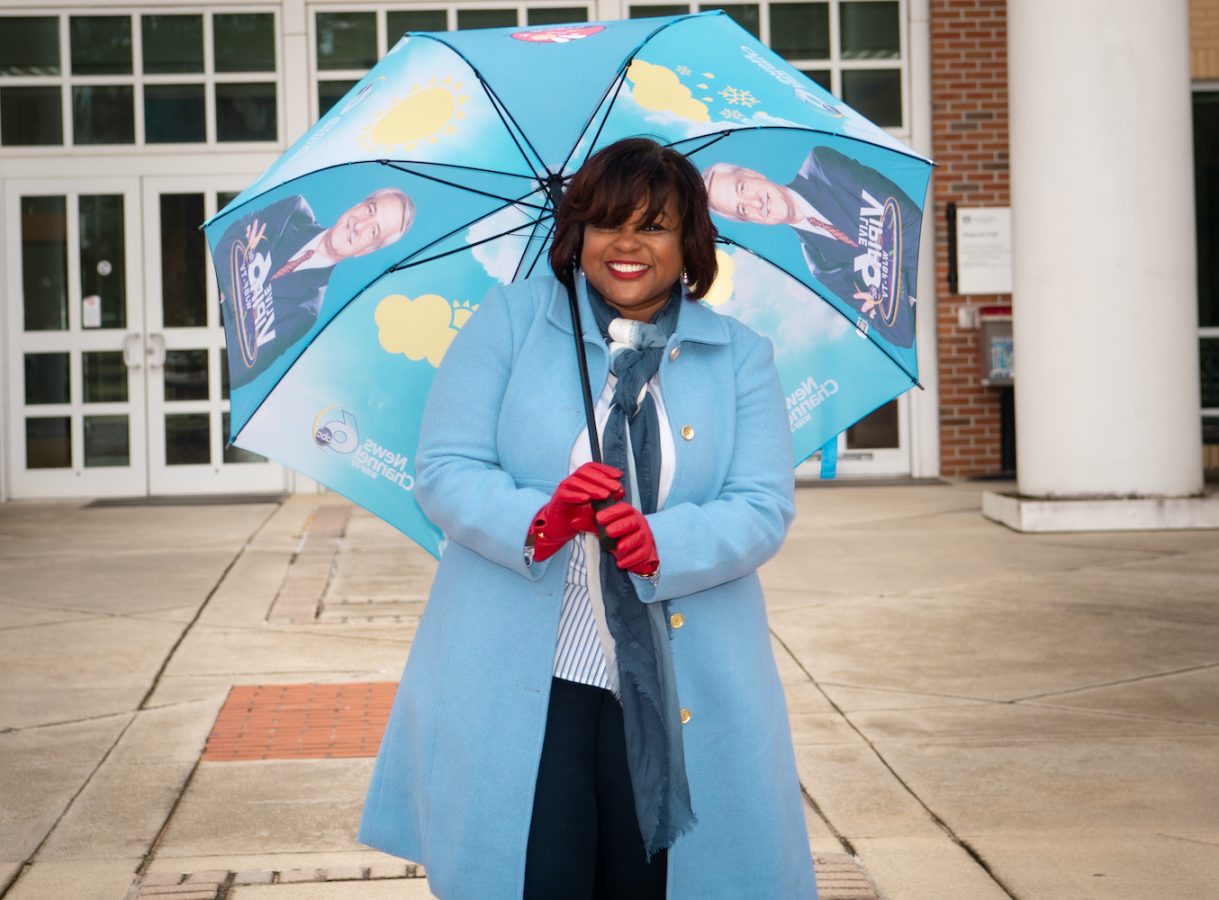 Woman standing with an umbrella