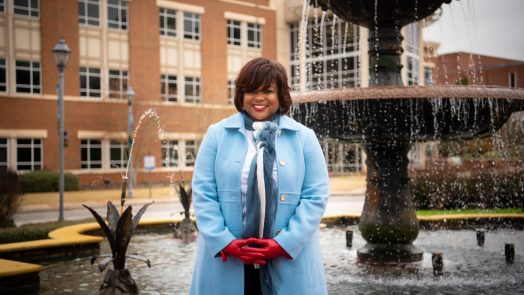 woman standing by a fountain