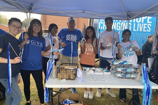 Men and women smiling