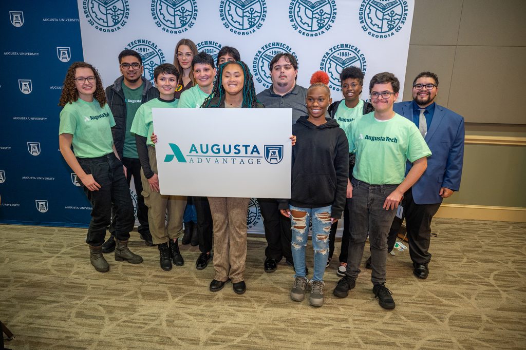 Group of people with Augusta Advantage sign