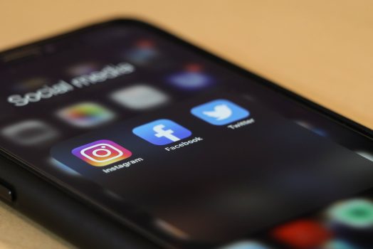 phone with social media icons on it