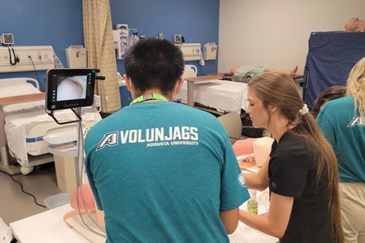 Students work in simulation center