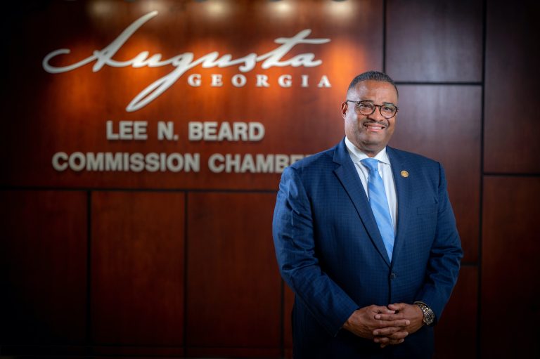 Man in front of Augusta Georgia sign