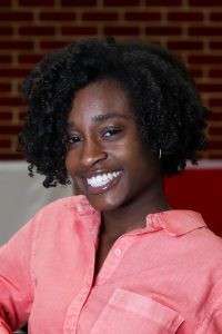 a woman wearing a pink shirt