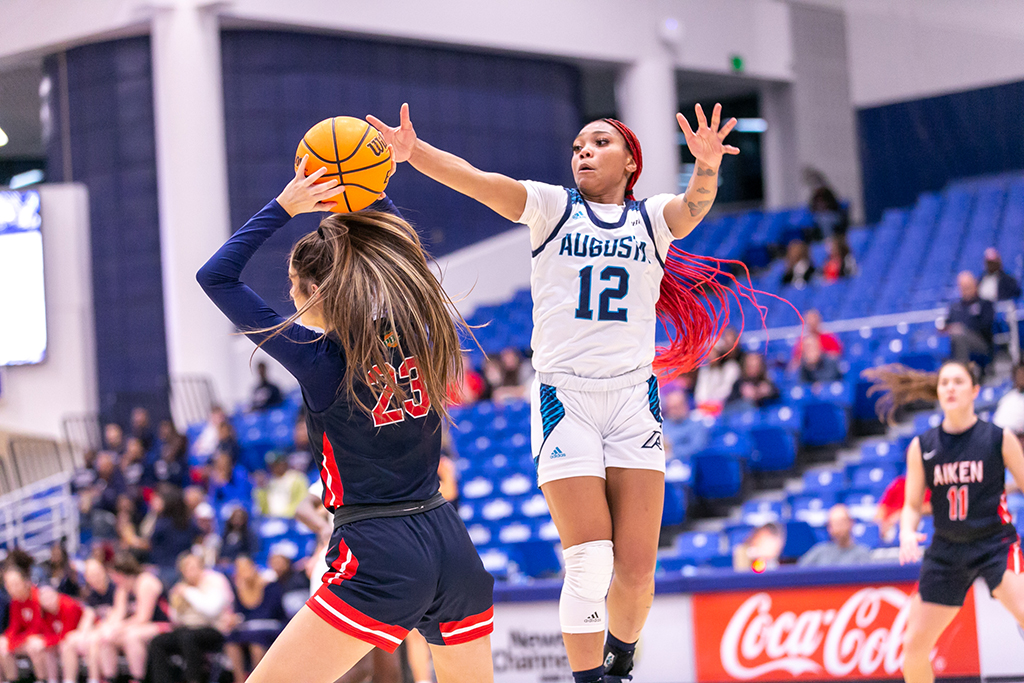 Women playing basketball