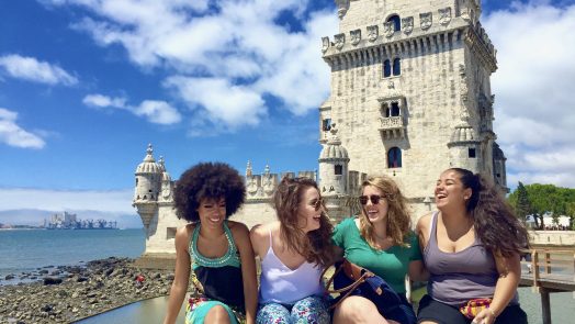 Four women pose overseas for their study abroad program