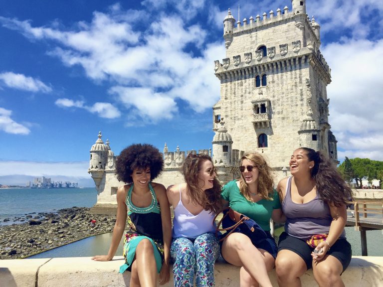 Four women pose overseas for their study abroad program
