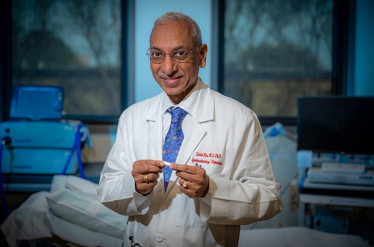 Dr. Satish Rao holding vibrating capsule