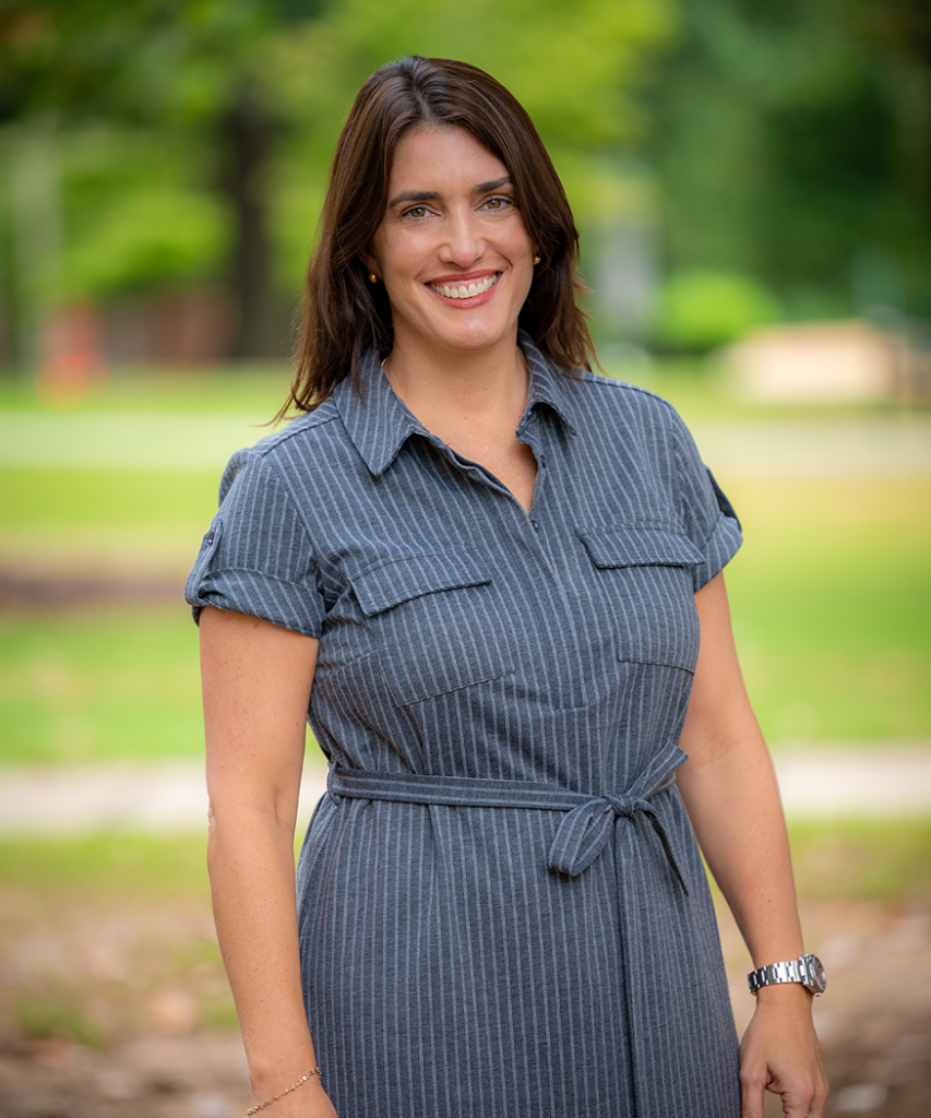 woman standing and smiling outside