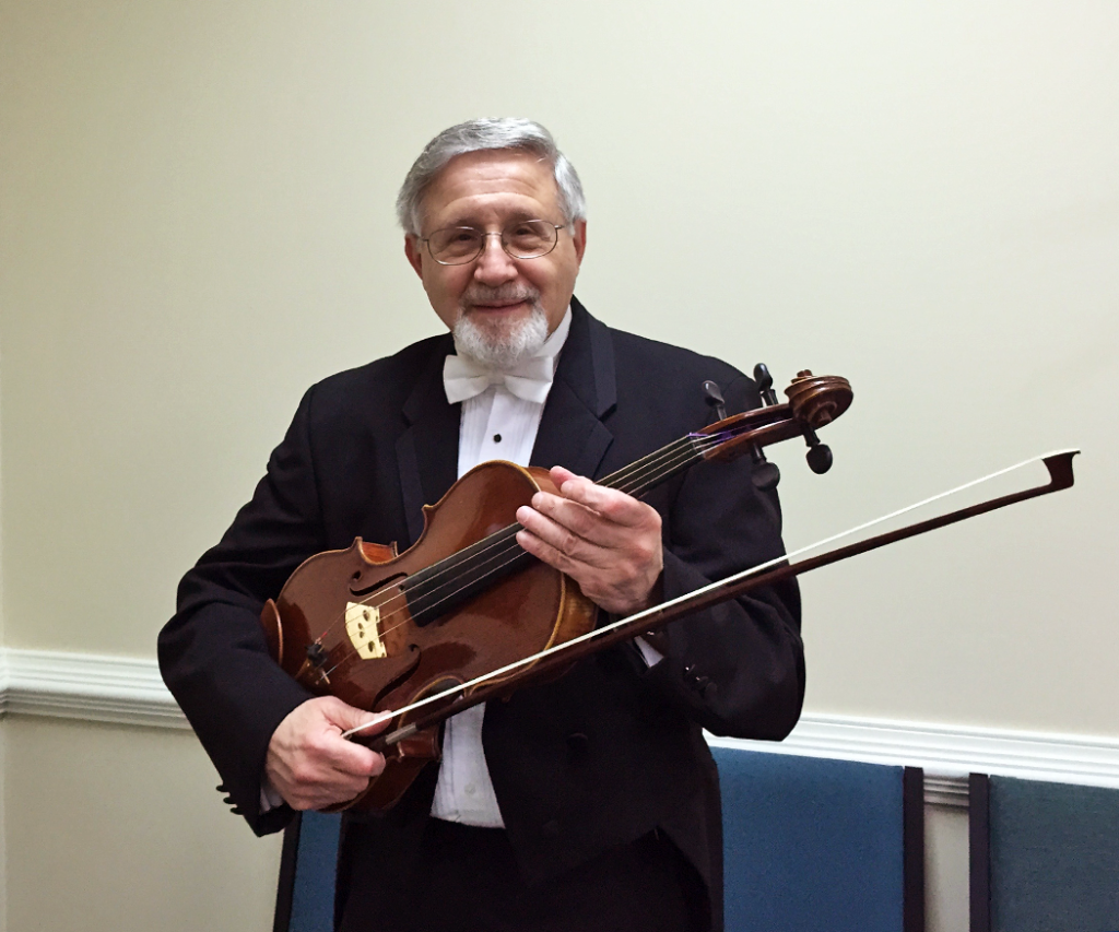 man holds viola and bow