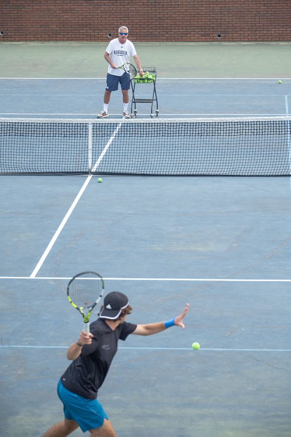 Men playing tennis