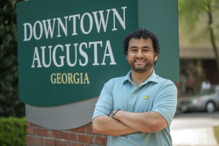 Man standing downtown