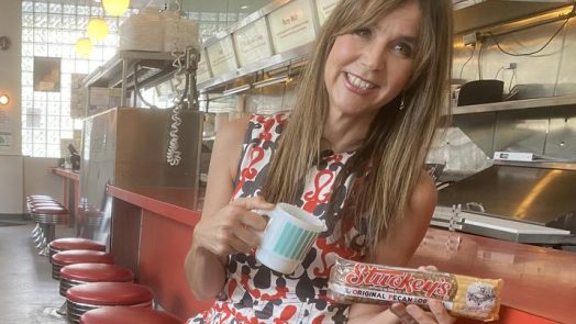 Woman in diner with candy and coffee
