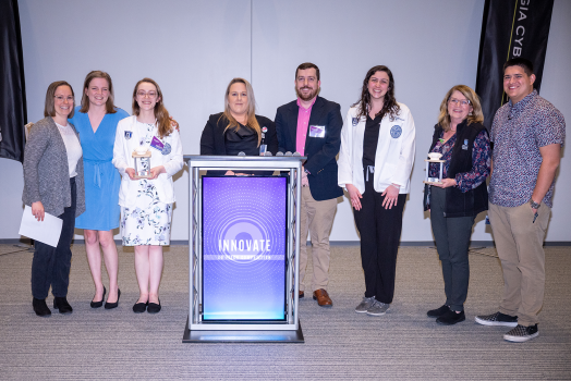 group of medical students together holding an award
