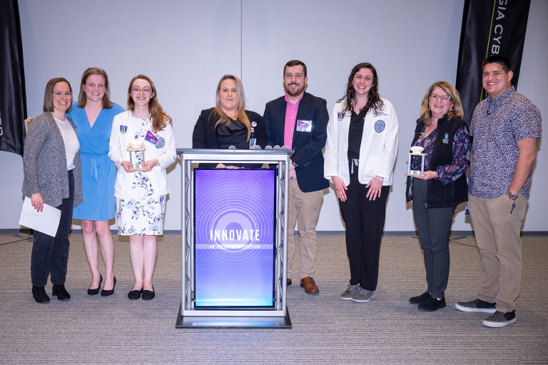 group of medical students together holding an award