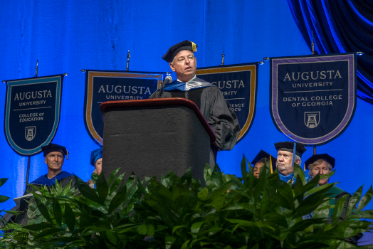 Keynote speaker on stage at Augusta University's Spring 2022 Commencement