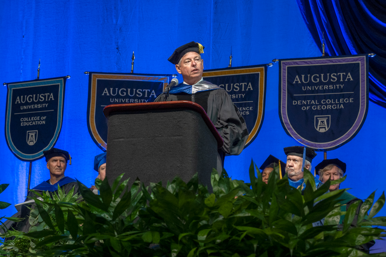 Keynote speaker on stage at Augusta University's Spring 2022 Commencement