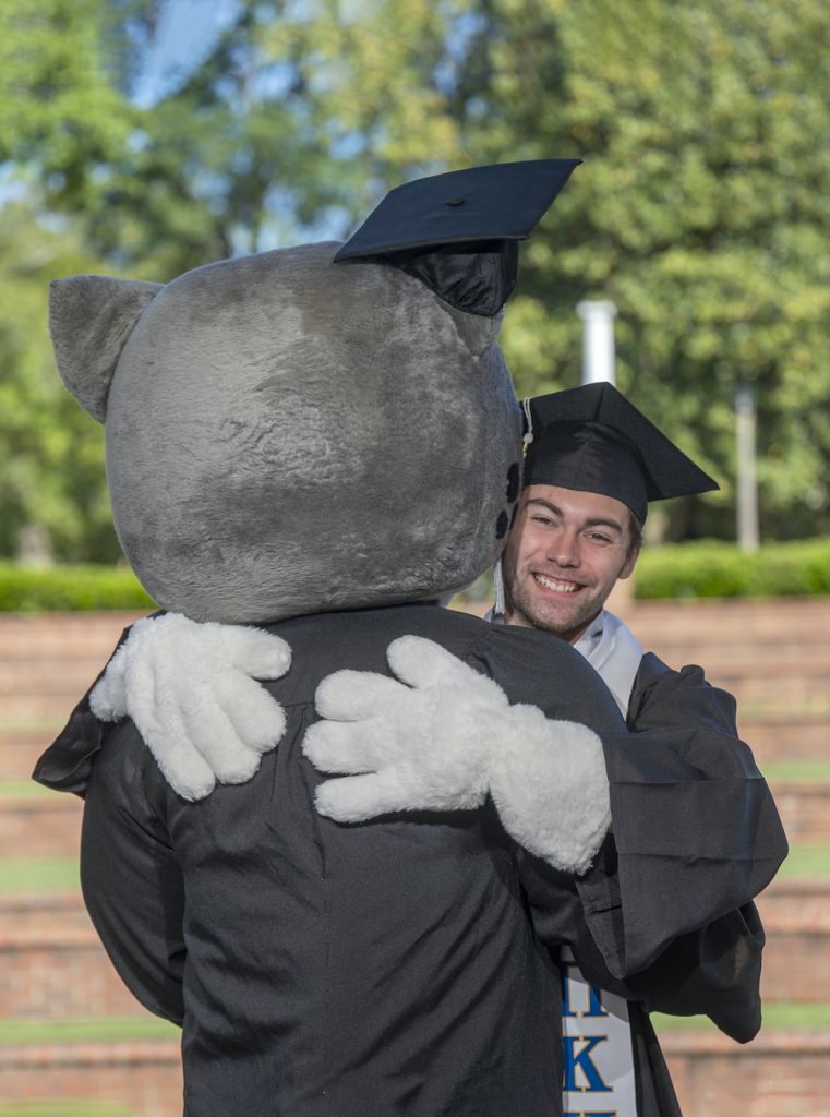 Student hugs Augustus