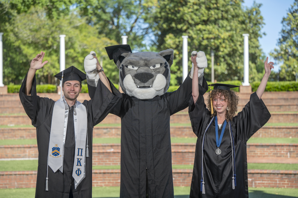 Two grads with Augustus 