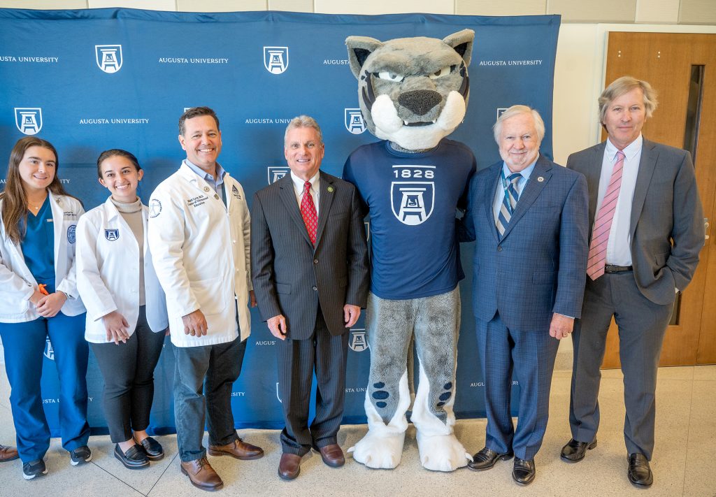 Group of people with Jaguar mascot