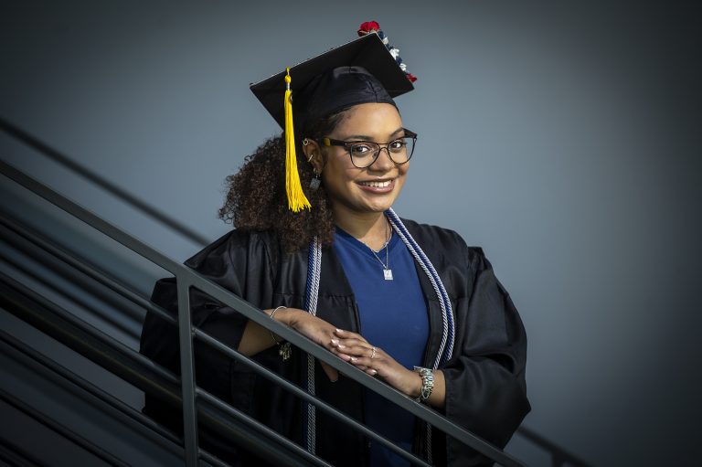 Woman in graduation cap and gown
