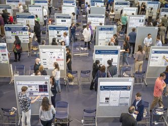 many graduate students present their research posters