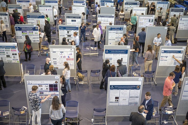 many graduate students present their research posters