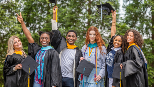 group of students wearing caps and gowns on Augusta University's Summerville Campus