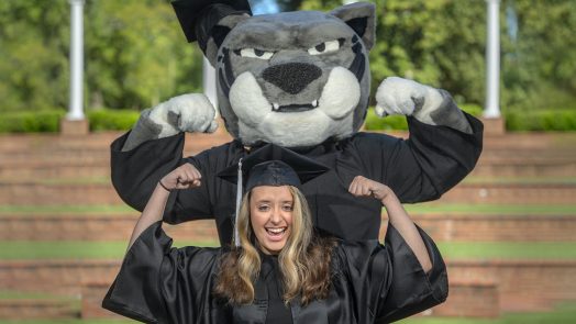 Graduate standing with Augustus.