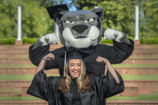 Graduate standing with Augustus.