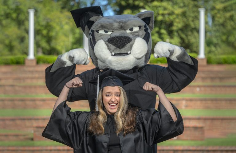 Graduate standing with Augustus.