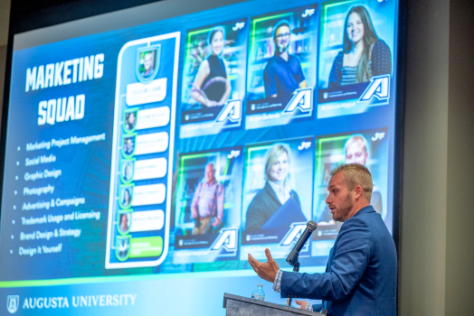 Taylor Lamb, director for Marketing and Creative Services, speaks at the 2022 Summer Summit in the Williams Ballroom in the Jaguar Student Activities Center.
