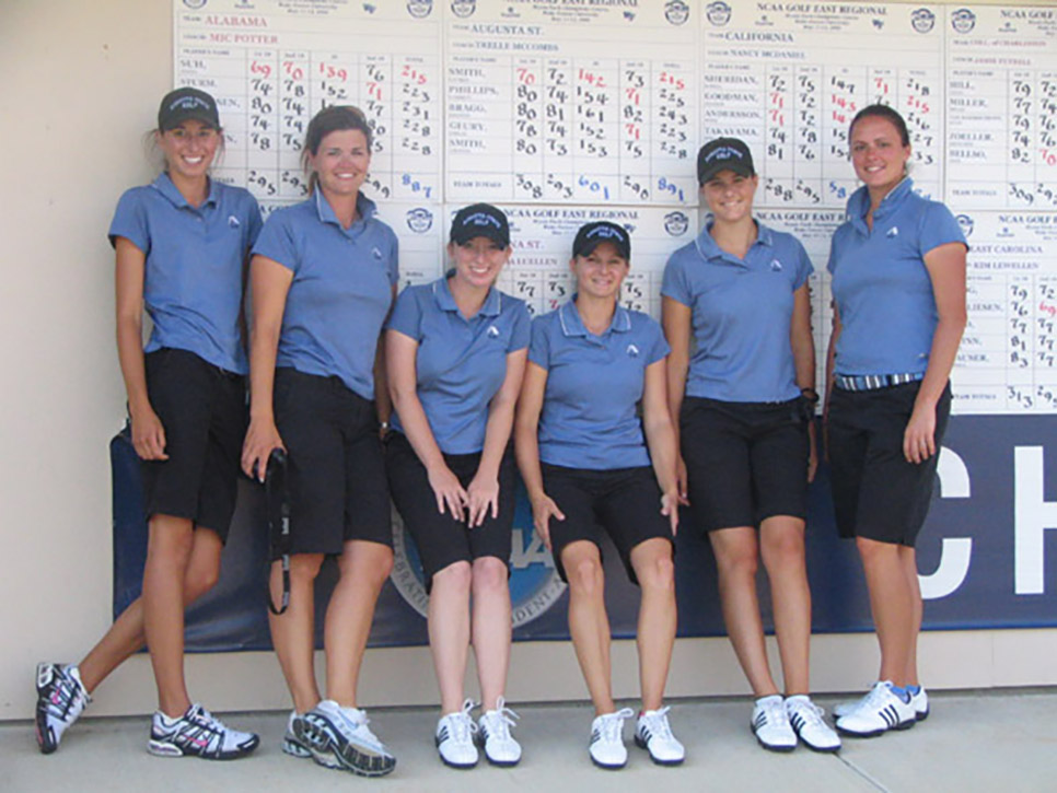 Women standing near leaderboard